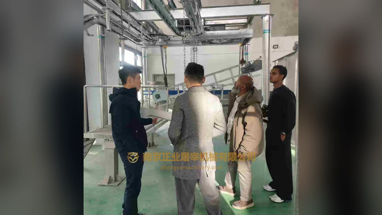 Australia-labelled visitors and Zhengye staff viewing workshop equipment
