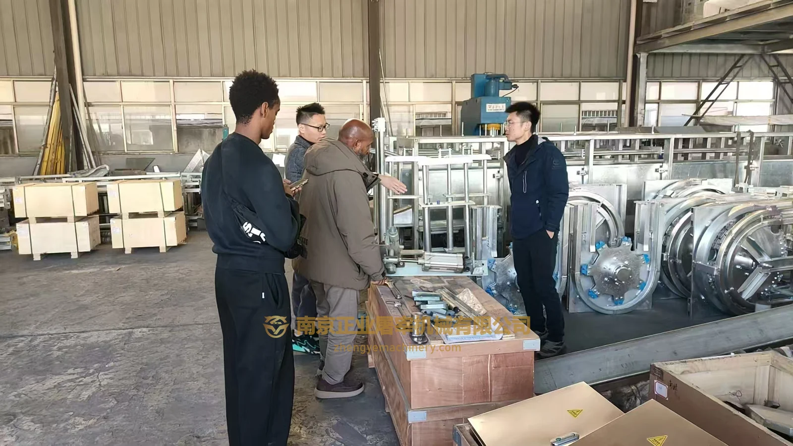 Australia visit group examining equipment in the workshop