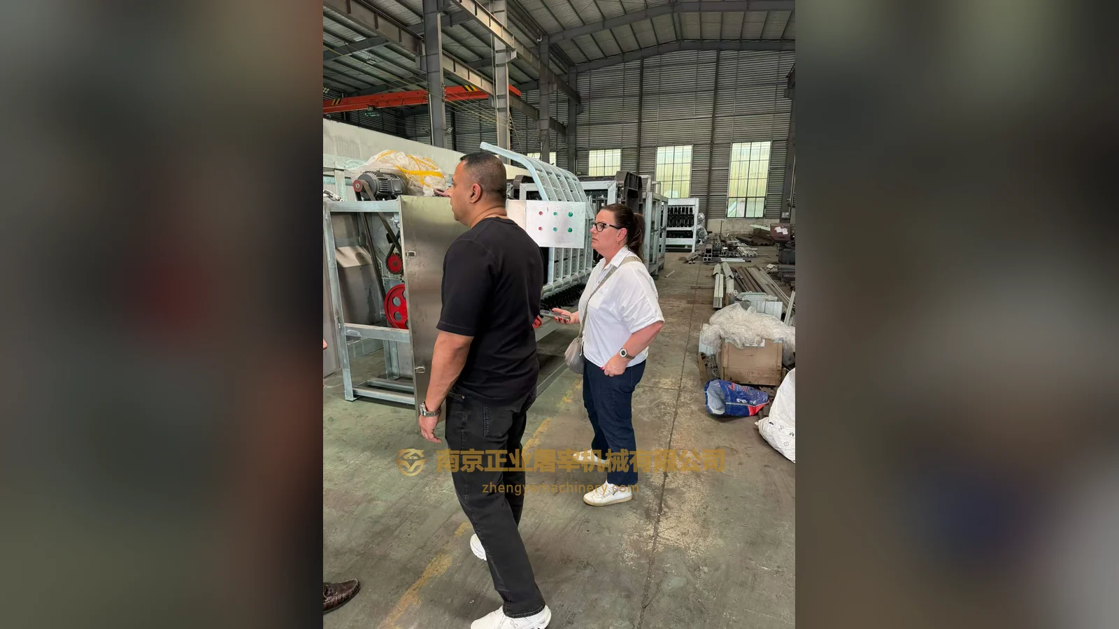 Australian clients viewing slaughter machinery in the manufacturing workshop during their visit