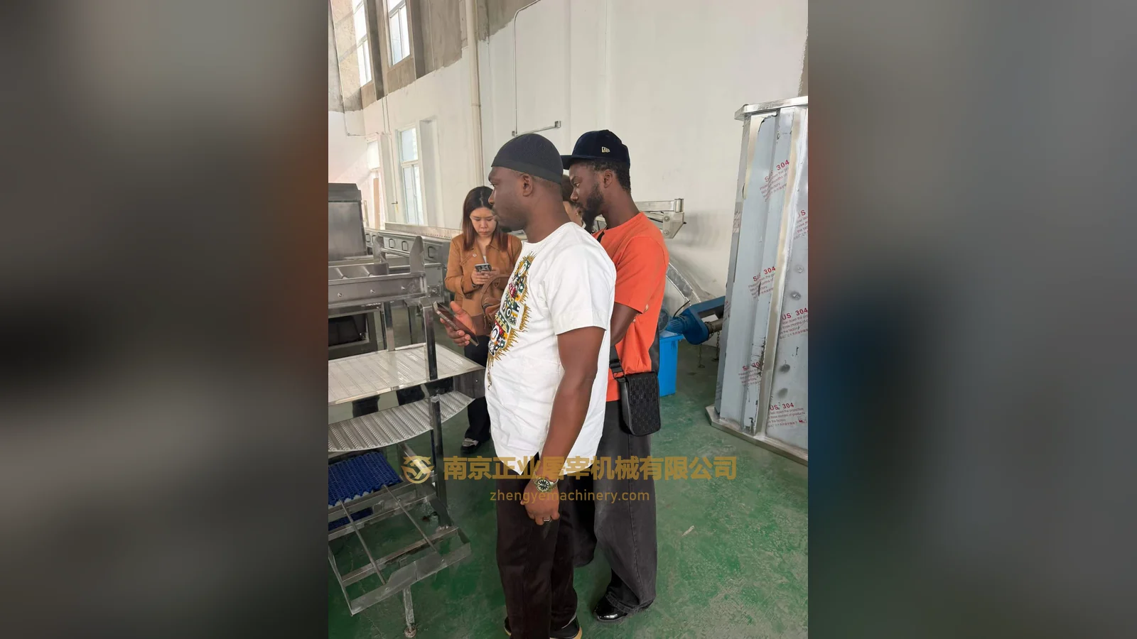 Clients from Ghana viewing slaughter machinery in the workshop
