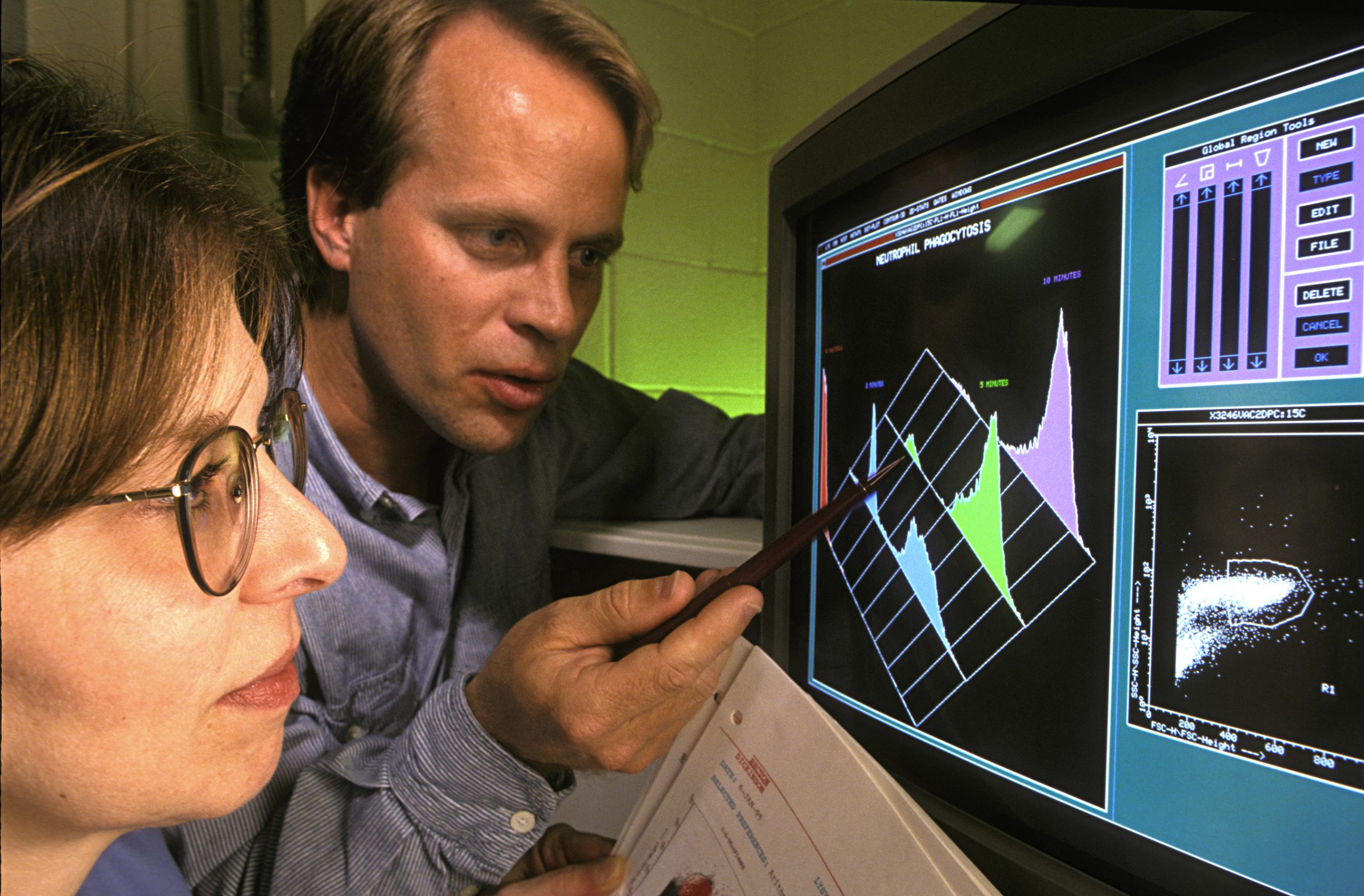 ARS researchers examine immune-cell populations in an archival laboratory photograph