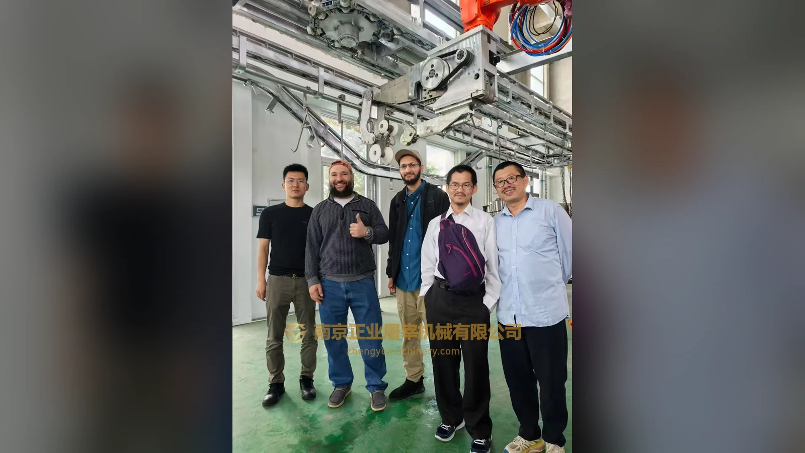 Chicago-labelled visitor group beside workshop equipment