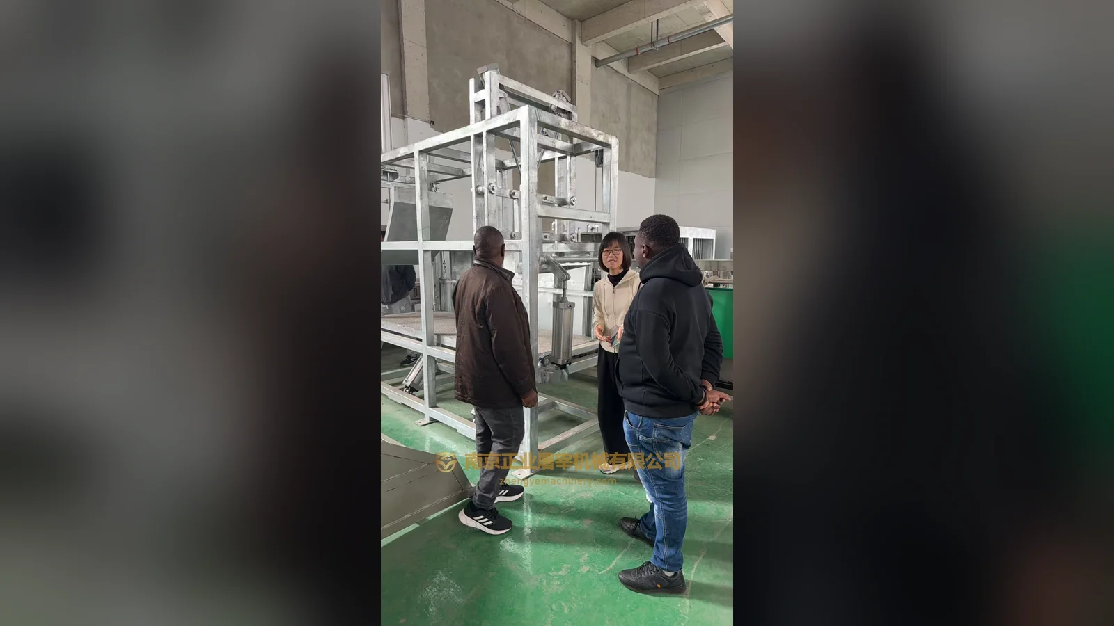 Visitors walking through an equipment workshop